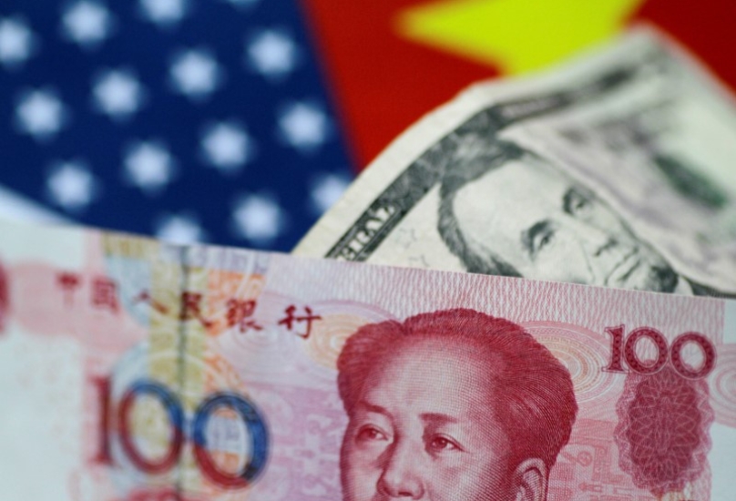 بنك الصين يقوم بإدراة قيمة اليوان عن طريق إبقاءه ثابتا أمام سلة من عملات الدول الشريكة للصين - أرشيف